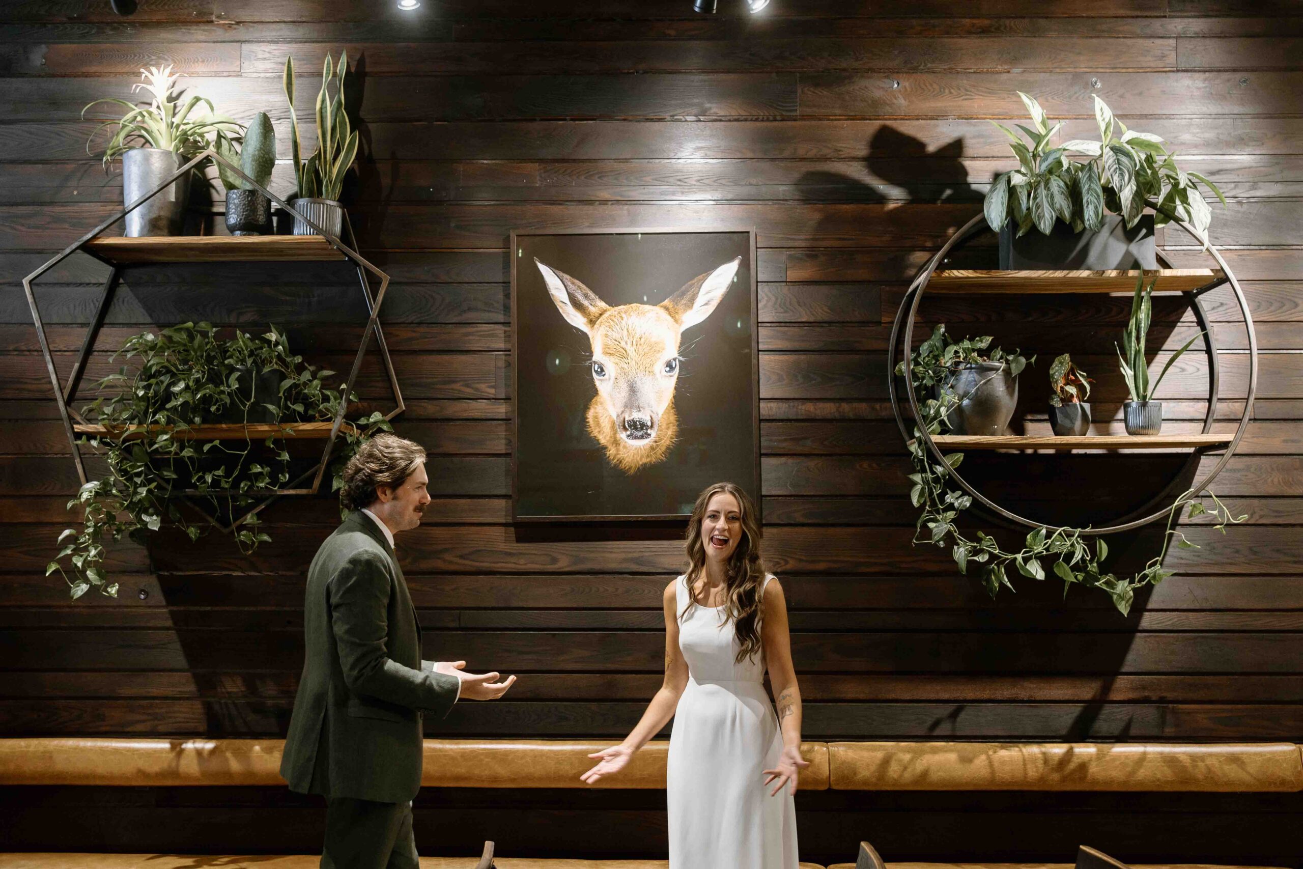 Bride and Groom standing inside an eclectic Asheville wedding venue during a colorful North Carolina wedding